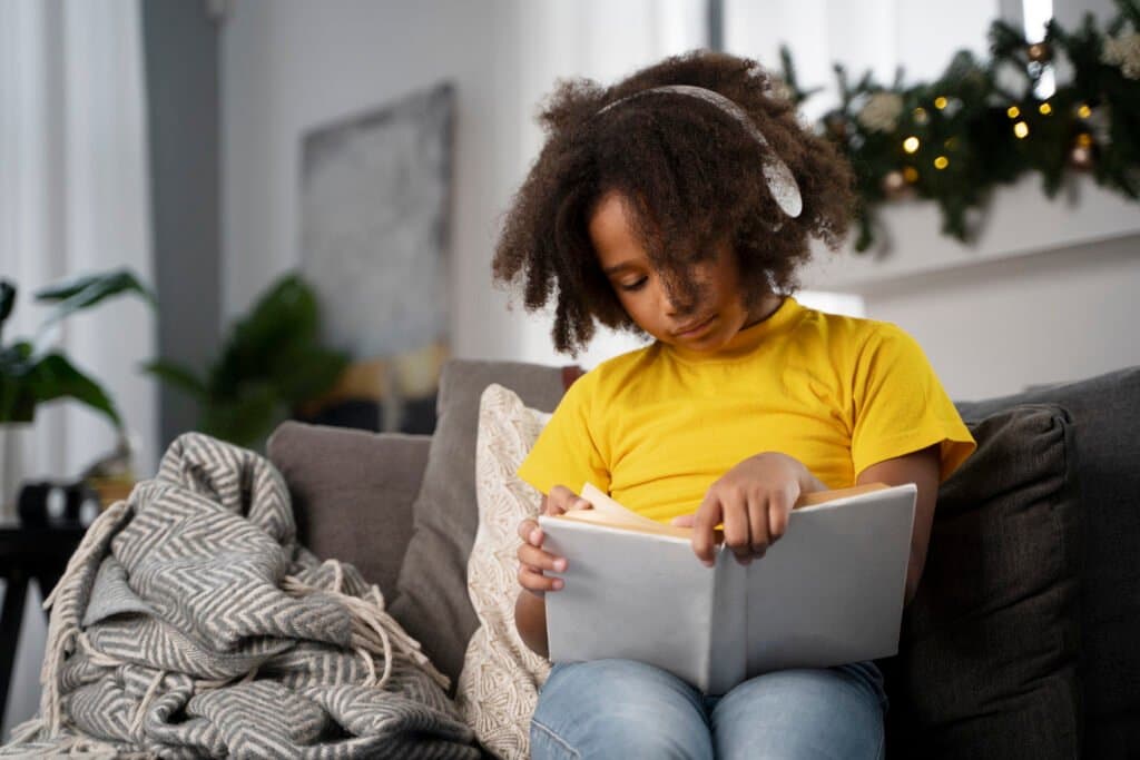 A-young-child-engrossed-in-one-of-the-many-classic-books-for-kids-highlighting-a-key-part-of-a-homeschool-reading-list
